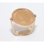 Unusual gold full sovereign ring set with 1967 sovereign on a hinged 18ct gold shank.