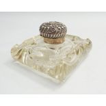 Victorian inkwell with heavy cut glass base and silver embossed lid 10cm wide   Condition - there is
