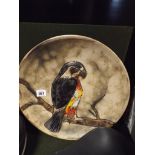 Potter charger with moulded decoration of a bird of prey,