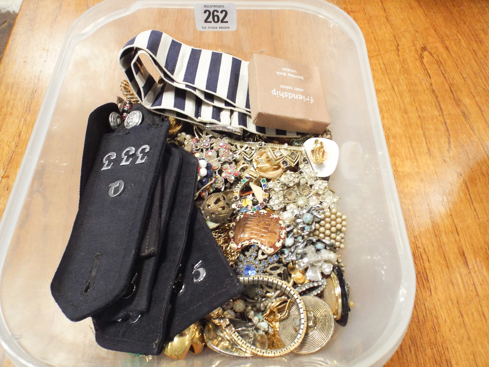 Box of costume jewellery including brooches, wristwatch etc.