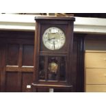 1930's striking wall clock in glazed case