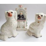 Two Staffordshire pottery dogs and a Staffordshire flat back figure of John Wesley