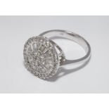 Modern 18ct gold diamond cluster cocktail ring set with brilliant and baguette cut diamonds in a