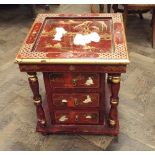 Red lacquered occasional table with fitted drawers below