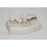 19th century Parian model of two reclining greyhounds on a rectangular tasselled cushion - 18cm