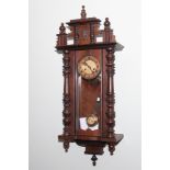 Edwardian Vienna style striking wall clock in walnut and glazed case