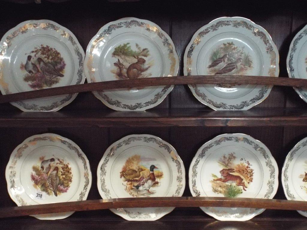 French porcelain dinner service comprising serving plate decorated with deer, 36.