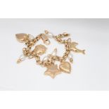 18ct yellow gold cultured pearl charm bracelet set with dophin, hearts, stars, ladybird charms.