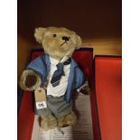 Teddy bear dressed as a school boy