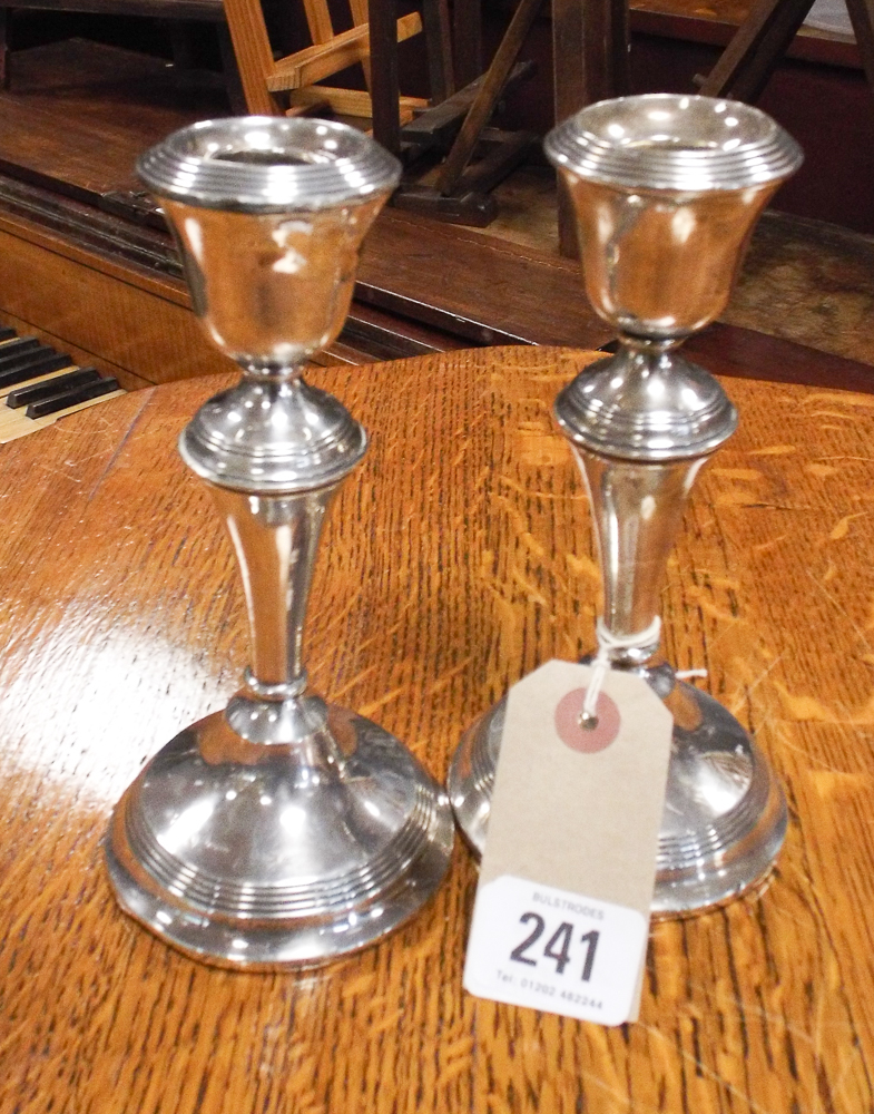 Pair of silver candle sticks with reeded decoration, hallmarked for Birmingham.