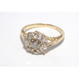 18 ct gold diamond cluster ring, set in a daisy style setting,