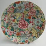 19th century Chinese porcelain shallow dish, all over multi coloured Famille Rose decoration of