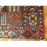 Red patterned Bakhtiari Persian rug (6' 6" x 5' 3")