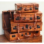 Set of 4 good quality leather expanding top suitcases