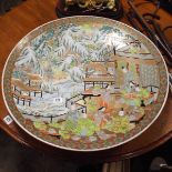 Large Cantonese charger decorated with figures and mountainous background approx 24" diameter