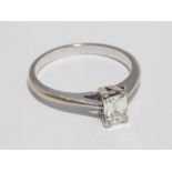 18ct white gold solitaire diamond ring, set with an emerald cut diamond of approx. 0.
