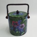 Trogonware pottery biscuit barrel with moulded decoration of a pheasant amongst flowers and