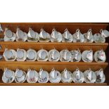 27 miniature bone china cup and saucer sets by Caverswall,