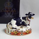 Royal Crown Derby paperweight Friesian cow Buttercup, gold button , original box etc.  Excellent -