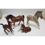 Three  Beswick  horses - a bay standing horse and two foals and a Zebra  Ear restored on large