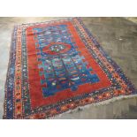 Red and blue patterned Kazak rug ( 6' 6" by 4' 6")