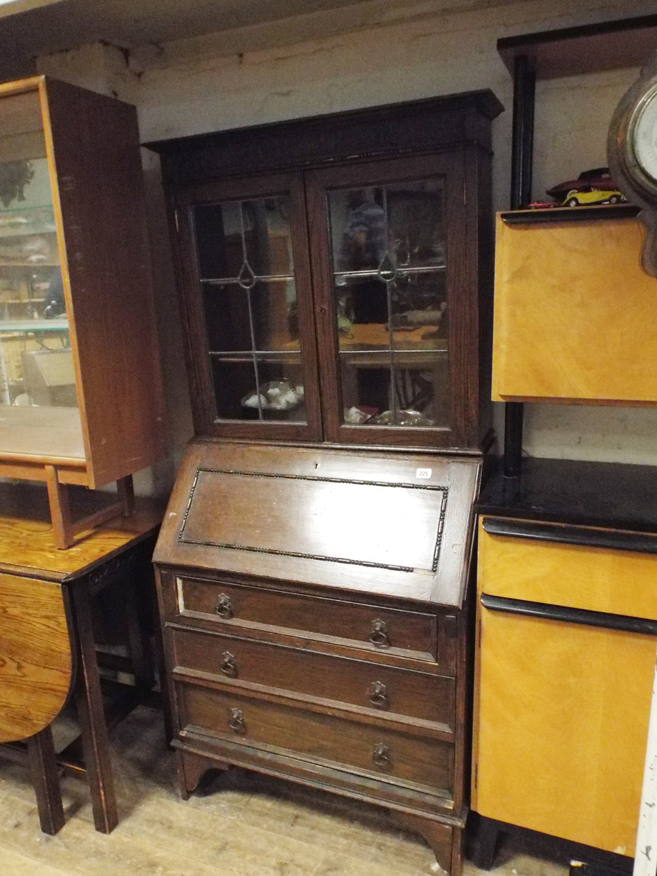 Small dark oak bureau/bookcase, fitted leaded glass doors to the top (A F)  As found