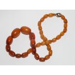 Graduated row of amber beads.