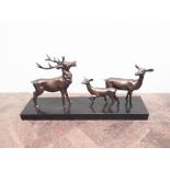 Bronze effect group of 3 deer standing on a marble plinth (approx 24" wide x 12" high)