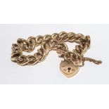9ct gold curb link bracelet, with gold padlock heart shaped fastening,