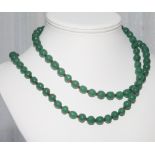 Long row of green jade beads,
