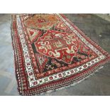 Red and patterned Kazak rug (7' 6" x 4' 8")
