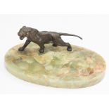 Large Asprey's green onyx ashtray with metal tiger surmount,