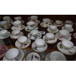 Collection of 52 miniature porcelain cups and saucers and trios by Wedgwood, Caverswall,