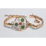 Chinese gold, jade, pearl and ruby set bracelet, set with a circular foliate panel,
