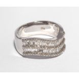18ct white gold wavy  band ring set with baguette and brilliant cut diamonds, shank stamped 750.