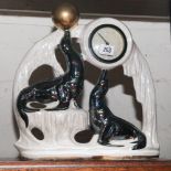 1950's mantel clock depicting sea lions in a lustre case