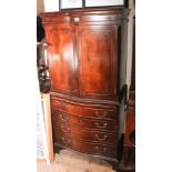 2'3 reproduction mahogany serpentine front tallboy with cupboards and four drawers under