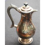 Victorian silver hot water jug, with ebony handle and finial, London marks 1883, weight 15 oz troy,