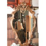 Shaped wall mirror in Victorian style gilt frame