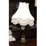 Brass and white porcelain table lamp with cream patterned shade