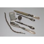 Collection of silver items to include sterling silver cased lighter, butter knife,