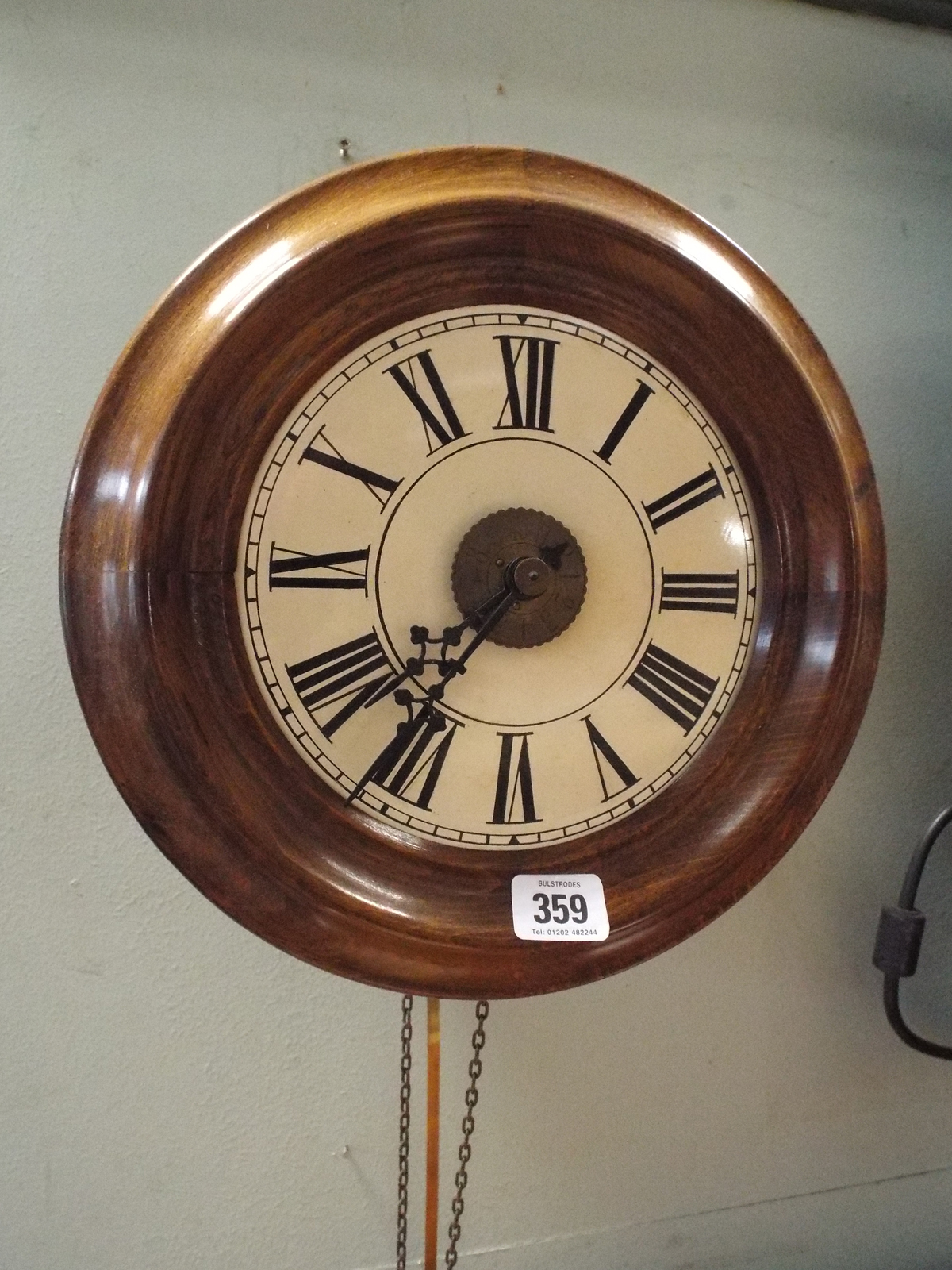Victorian circular postman's clock with mahogany case and white enamel dial 11.