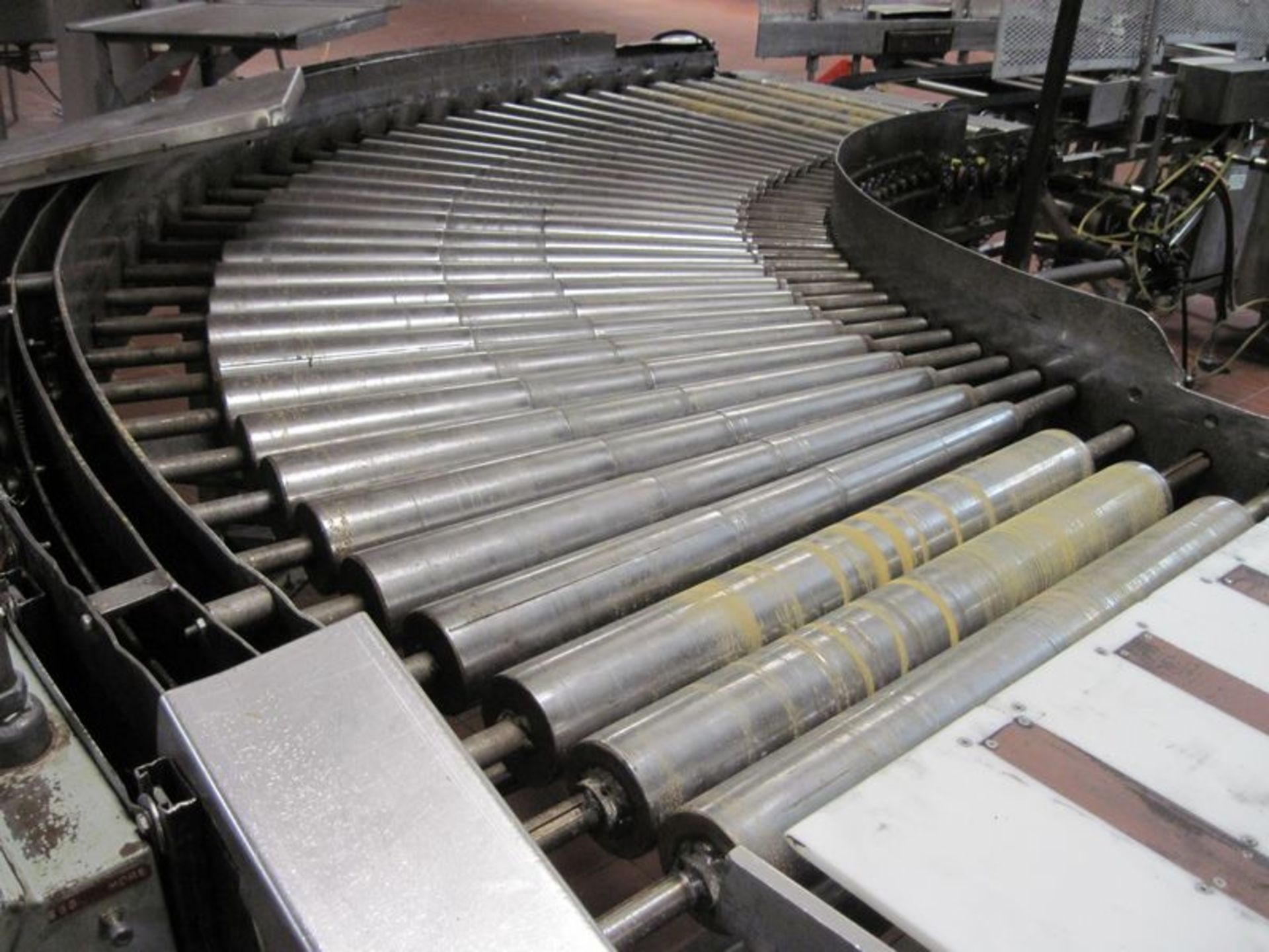 90 Degree power roller conveyor. With approximate 0.5hp gear motor, steel frame. (Subject to