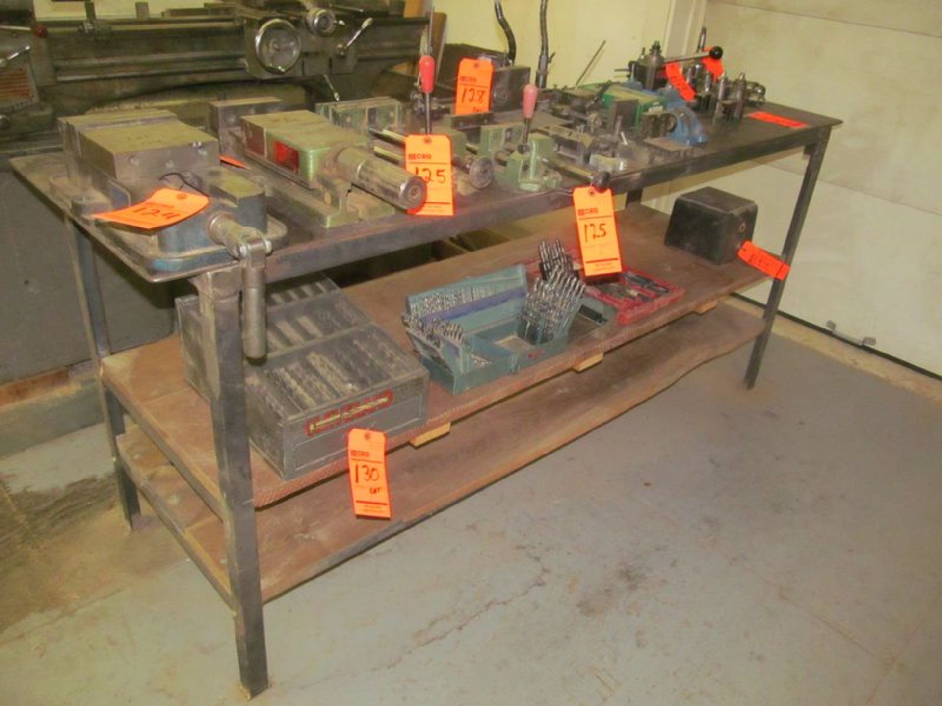 24" X 78" steel work bench with (2) wood undershelves (NO contents)