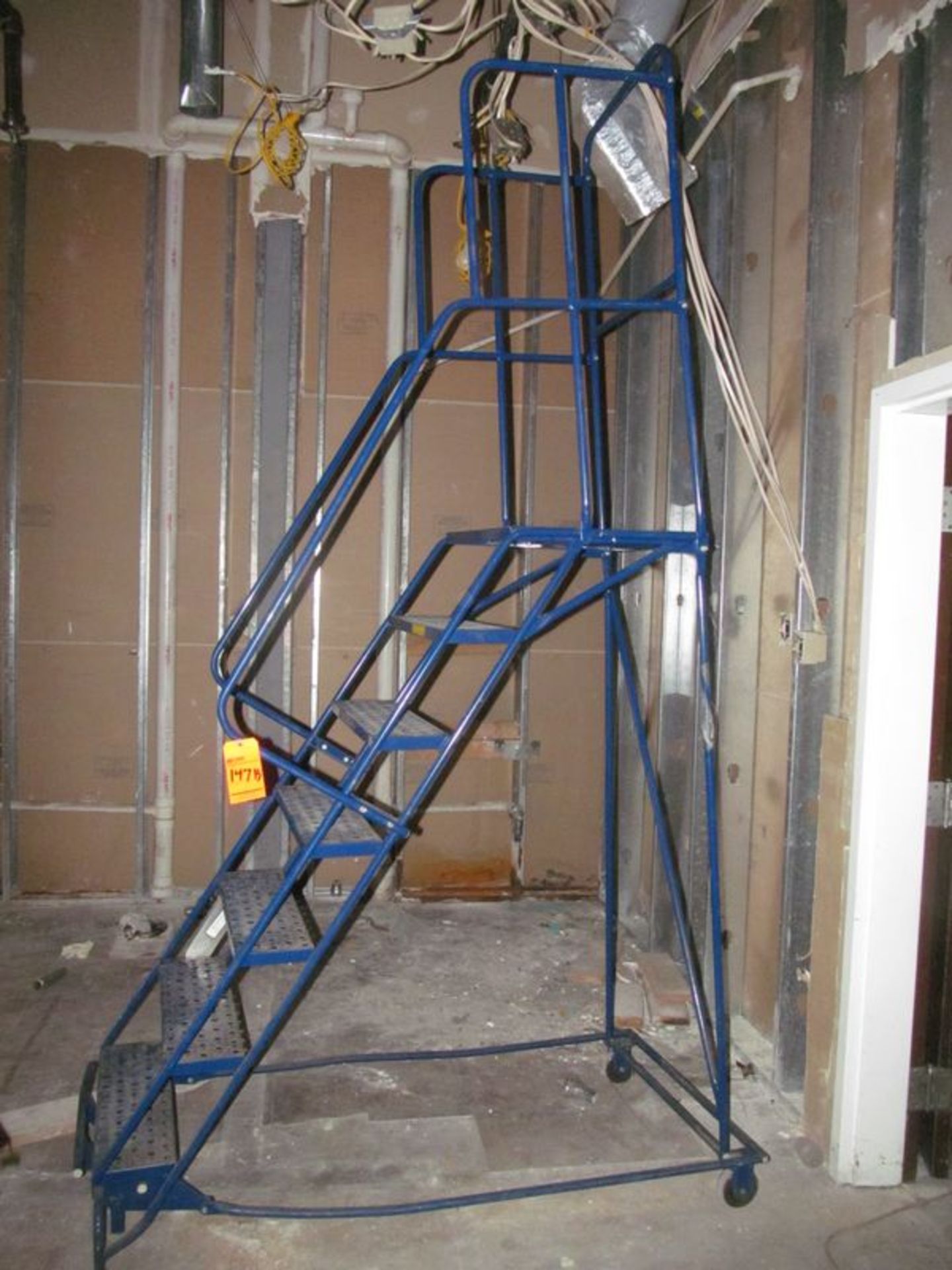 Lot (2) ass't portable metal stock ladders; (1) 7-step and (1) 3-step