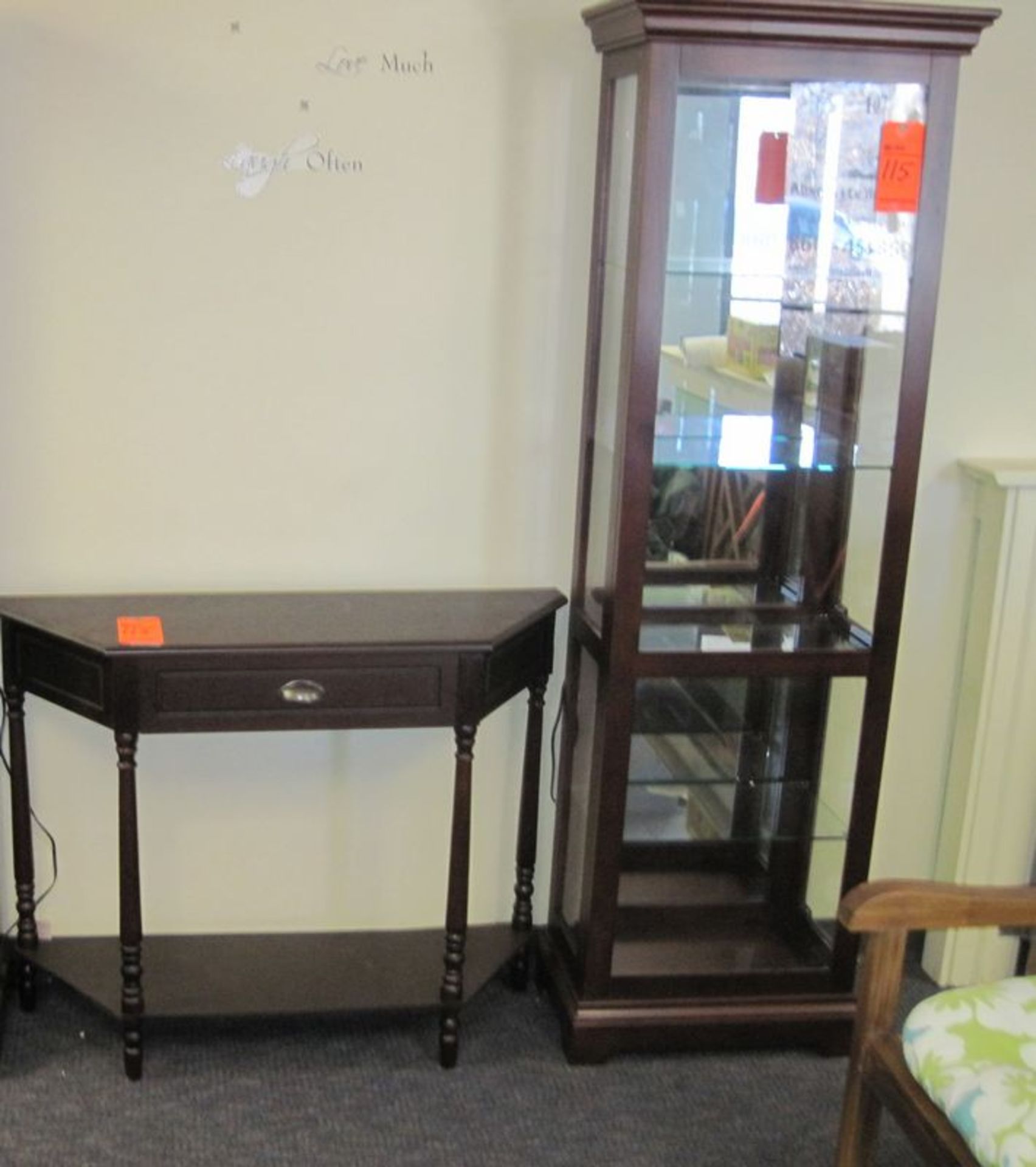 Lot includes 6' X 20" glass display cabinet with lighting, 4-tier and (1) side table, single