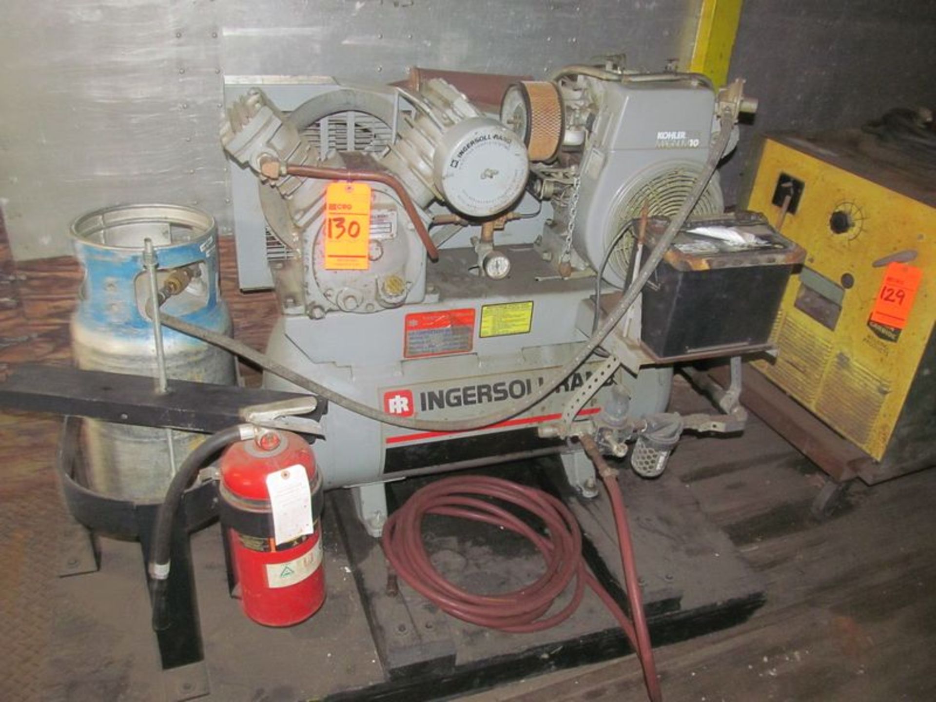 Ingersoll-Rand horizontal compressor, twin cylinder, 10 HP motor, skid mounted, propane powered