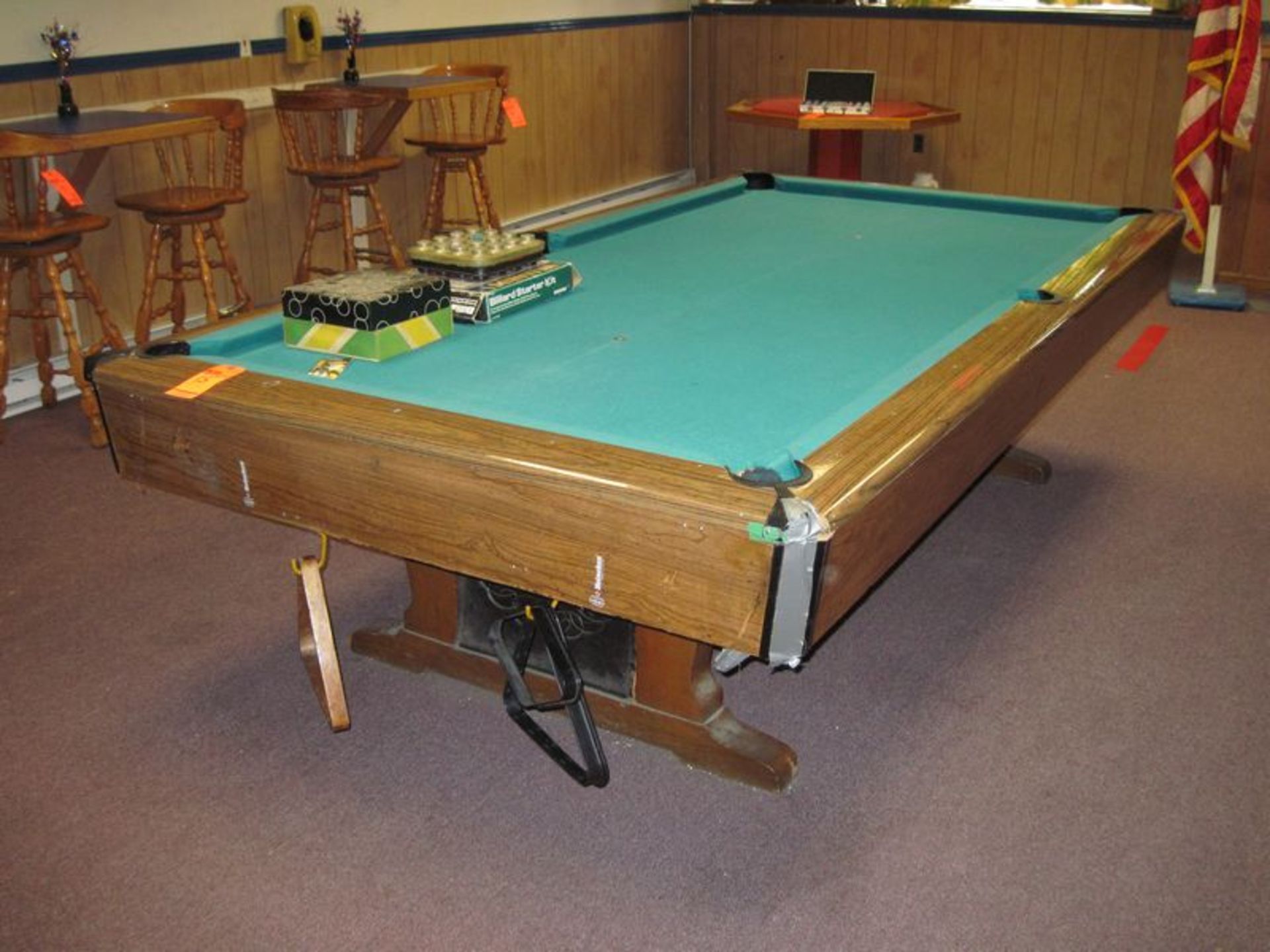 Lot includes Brunswick slate top pool table, (4) sets of balls, rack with (6) pool cues, box of (10)