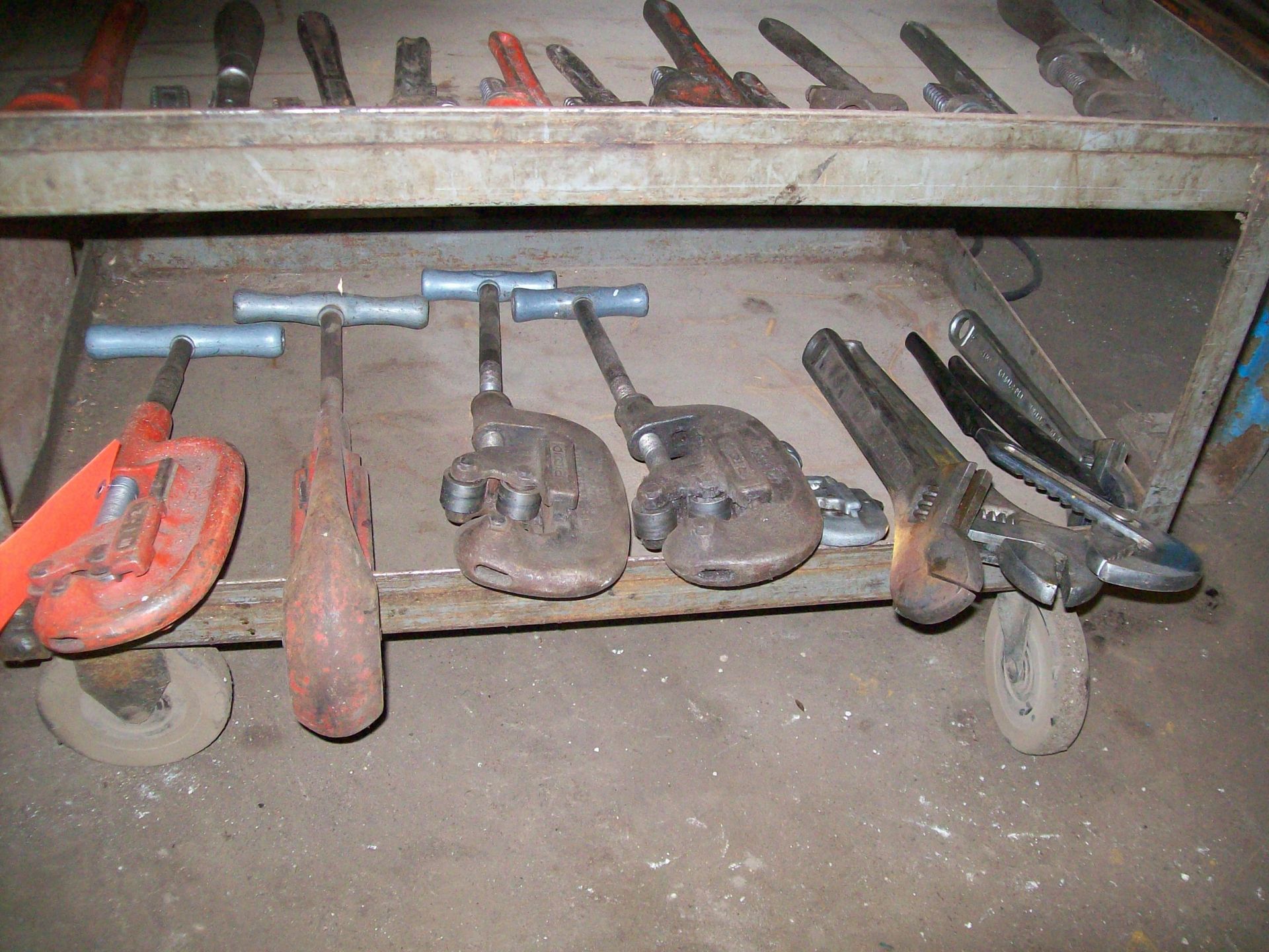 Lot (5) ass't manual pipe cutters with cart, (3) adjustable wrenches and (1) channel lock wrench