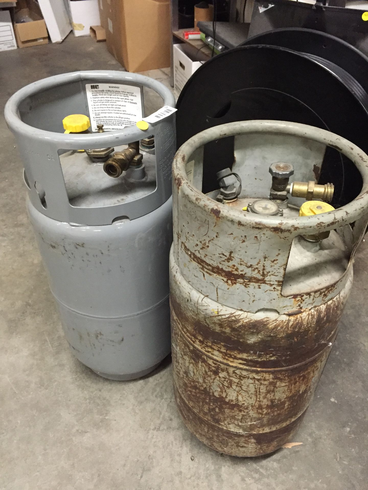 Lot of (2) assorted 30 lb. propane tanks, partially full
